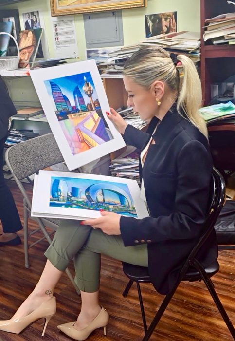 Nubar Azimova reviewing artworks in the studio