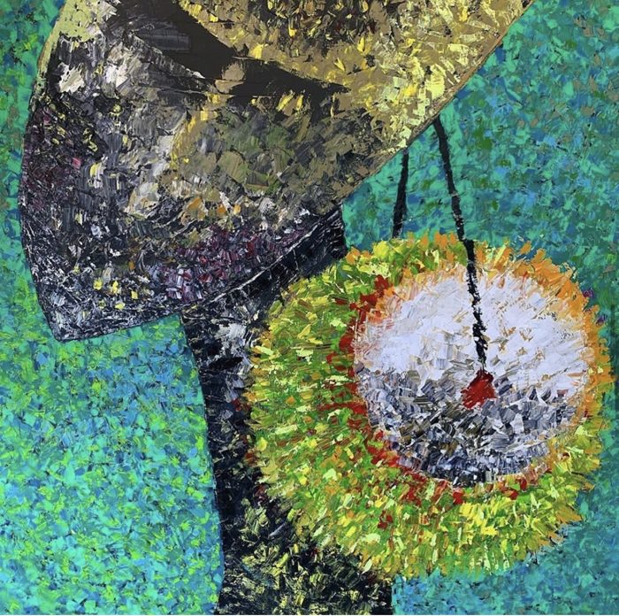 Figure beneath a patterned hat